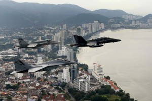 A formation containing a Malaysian F/A-18D Hornet, a MIG 29 and an Australian F/A 18 Hornet fly over the Penang region of Malaysia, the flight was organized as a prelude flight to Bersama Lima 2011. 
