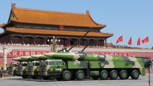 Military vehicles carrying missiles march at the Tiananmen Square during a military parade to mark the 70th anniversary of the end of World War Two, in Beijing, China, September 3, 2015. China's President Xi Jinping and world leader inspected 12,000 troops marching across the square. ( The Yomiuri Shimbun via AP Images )
