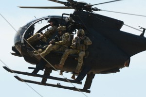 A US MH-6 Little Bird carrying operators on a rig designed to carry personnel. US Army picture