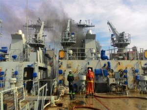 Thick black smoke coming out from the rear end Teguh Samudera as seen from the helicopter deck. From the picture, most of the surface work on Gagah (port) has been completed while on Teguh it appears more job is needed. Bomba picture