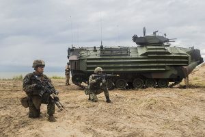  U.S. Marine Lance Cpl. Jamie Camacho, left, and a Malaysian soldier begin their amphibious beach assault during Malaysia-United States Amphibious Exercise 2015 near Tanduo, Lahad Datu.During the culminating event, Malaysian soldiers alongside Marines assaulted the beach using tactics learned throughout MALUS AMPHEX 15. (U.S. Marine Corps photo by Sgt. Emmanuel Ramos/Released)