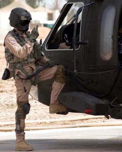 A US Army Blackhawk crew chief with his personal protection equipment including Maxillofacial Shield. US Army photo 