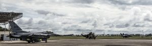 A U.S. Air Force F-16 Fighting Falcon from the 13th Fighter Squadron, waits for a Royal Malaysian Air Force F/A -18 D Hornet with the 18th Squadron, to taxi by during exercise Cope Taufan 2016, at Pangkalan Udara Butterworth , Malaysia, July 20, 2016.   (U.S. Air Force photo by Tech. Sgt. Araceli Alarcon)