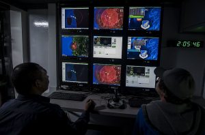 A Royal Malaysian Airman and a Joint Deployable Electronic Warfare Range (JDEWR) systems controller, monitor aircraft during Cope Taufan 16, at  Butterworth Air Base, Malaysia July 22, 2016.  RMAF 