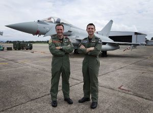 Officer Commanding 1(F) Sqn, Wing Commander Mike Sutton (left) and RAF Lossiemouth's Station Commander, Group Captain Paul Godfrey (right) stood in front of a Typhoon while taking part in Ex Bersama Lima 16. Crown Copyright 