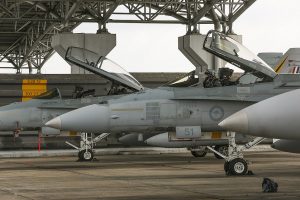 Under the shed. The pilot of a Royal Australian Air Force F/A-18A Hornet conducts pre-flight checks in the cockpit moments before commencing a mission from Royal Malaysian Air Force Base Butterworth as part of Exercise Bersama Lima 16.  CA